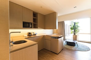 Sanctuary 90 King | Private kitchen | Mini-fridge, microwave, electric kettle, dining tables