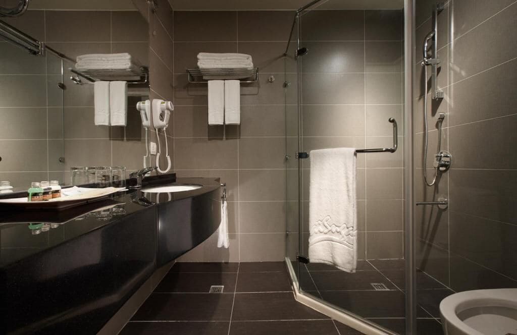 hair dryer, slippers, bidet, towels