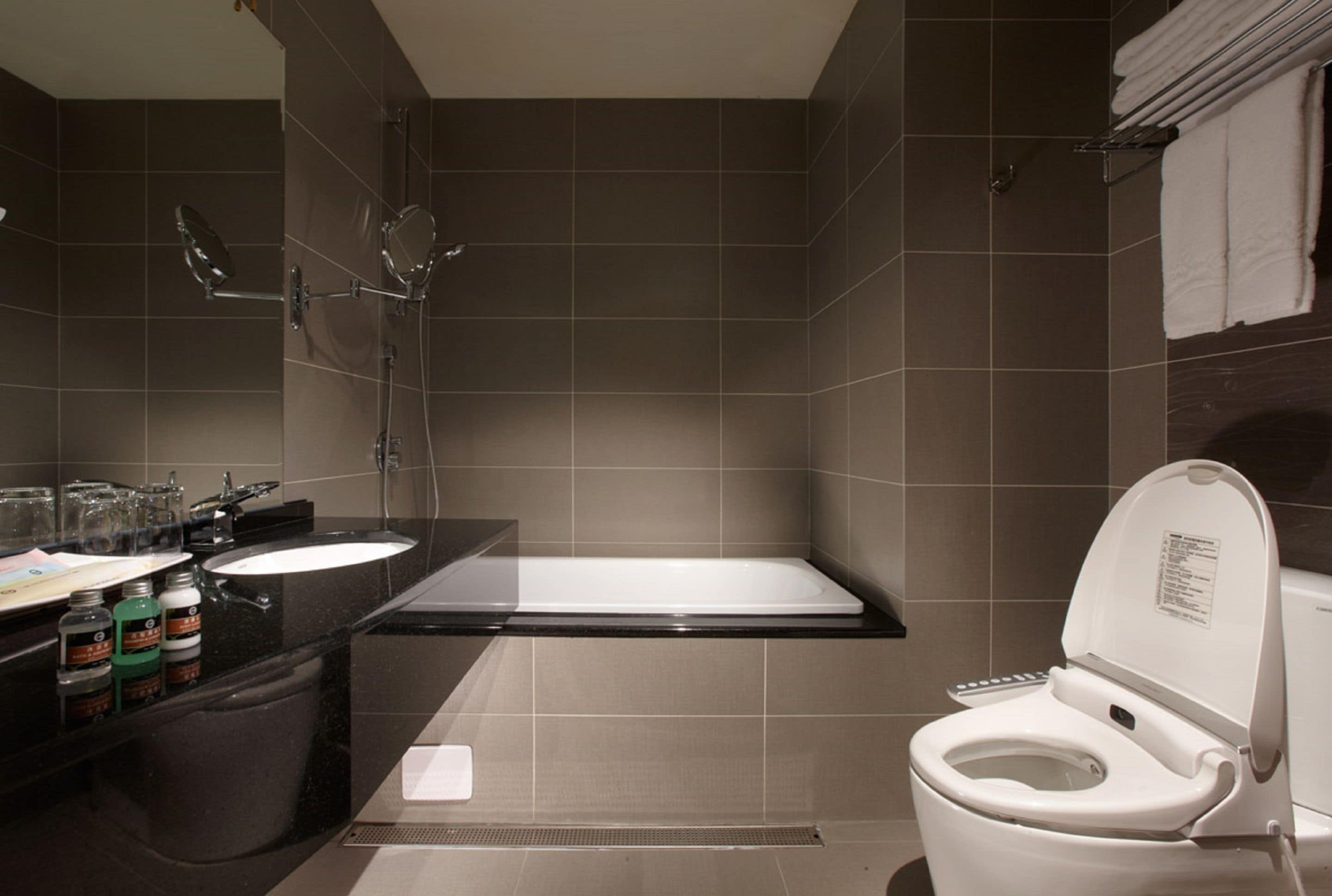 hair dryer, slippers, bidet, towels