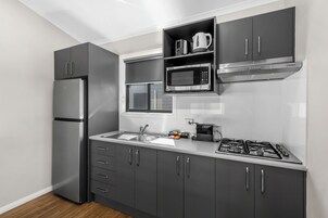 Deluxe 2 Bedroom Cabin | Private kitchen | Microwave, stovetop, toaster, cookware/dishes/utensils