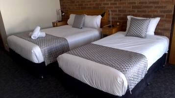 Comfort Queen Triple | Premium bedding, pillowtop beds, desk, laptop workspace