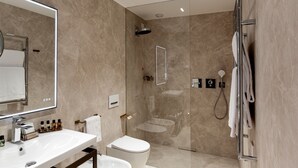 A modern bathroom with a glass-enclosed shower, a white sink, and a large mirror. - Hotel Ceccarini 9 (Riccione)
