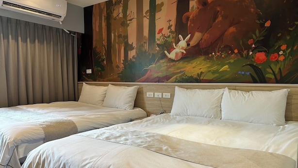 A hotel room with two beds, a large forest-themed mural, and an air conditioning unit. - Dazz Inn (Taichung)
