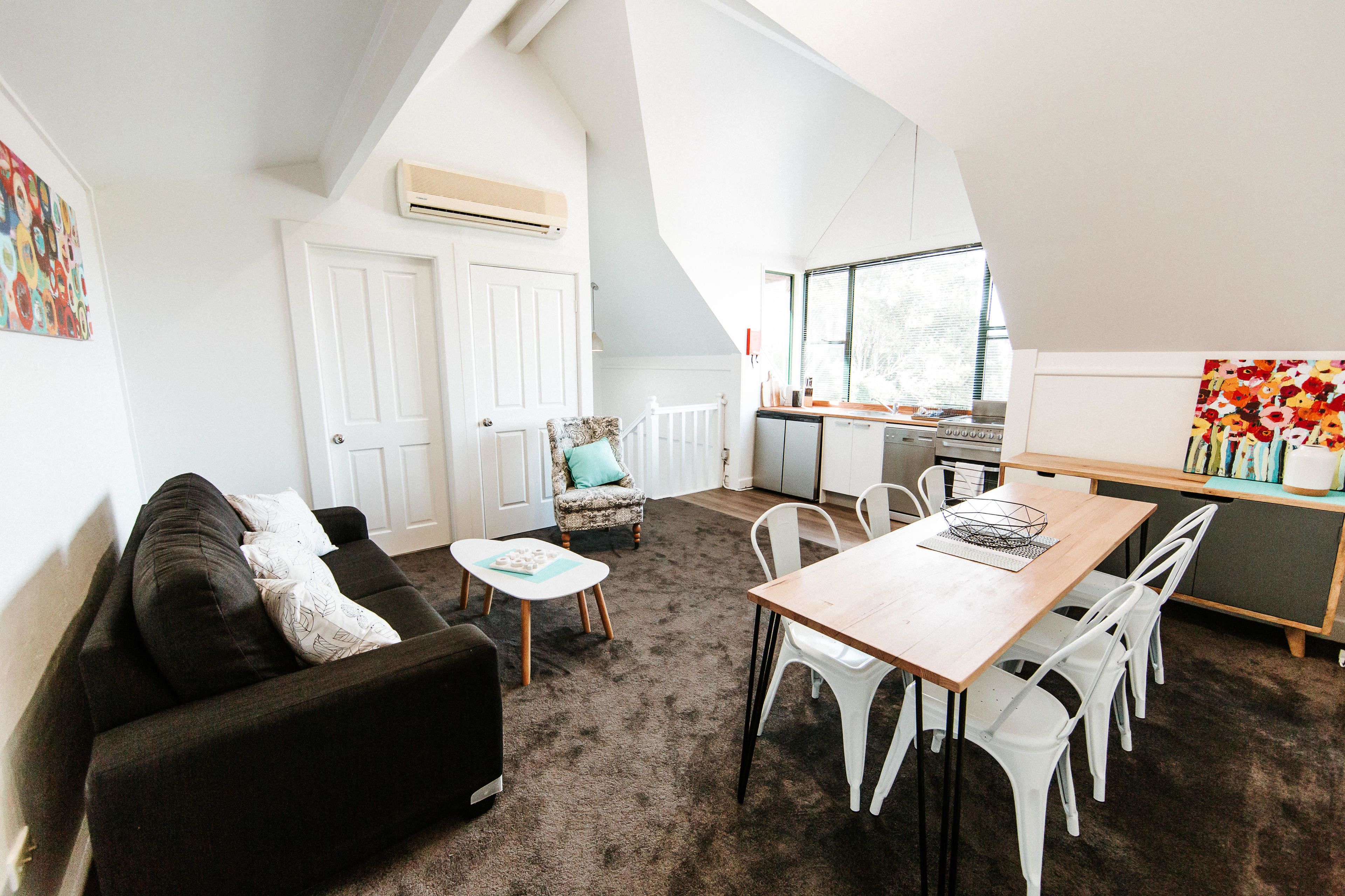 one or two bedroom king suite | living area | flat-screen tv