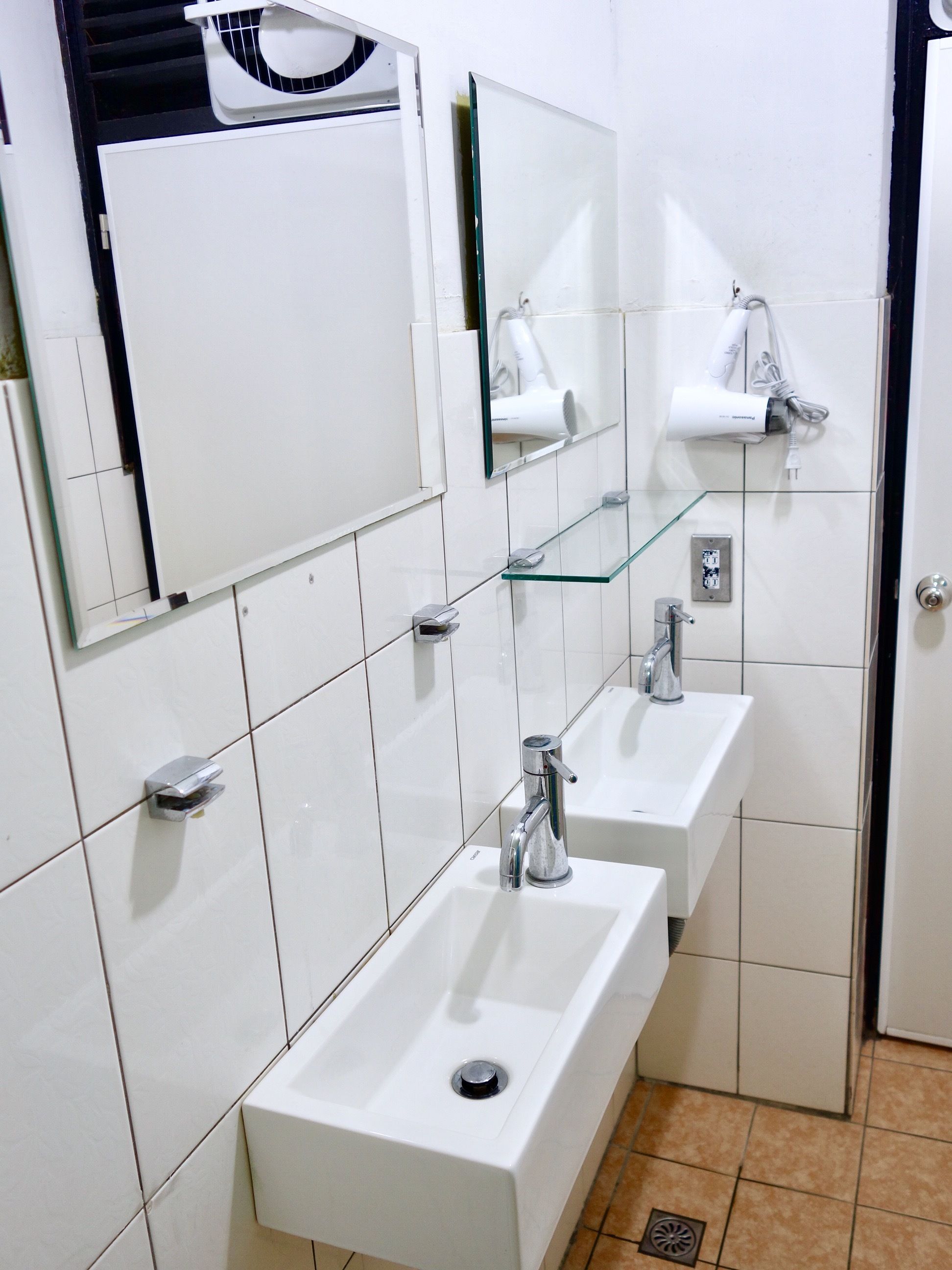 Shower, hair dryer, slippers, towels