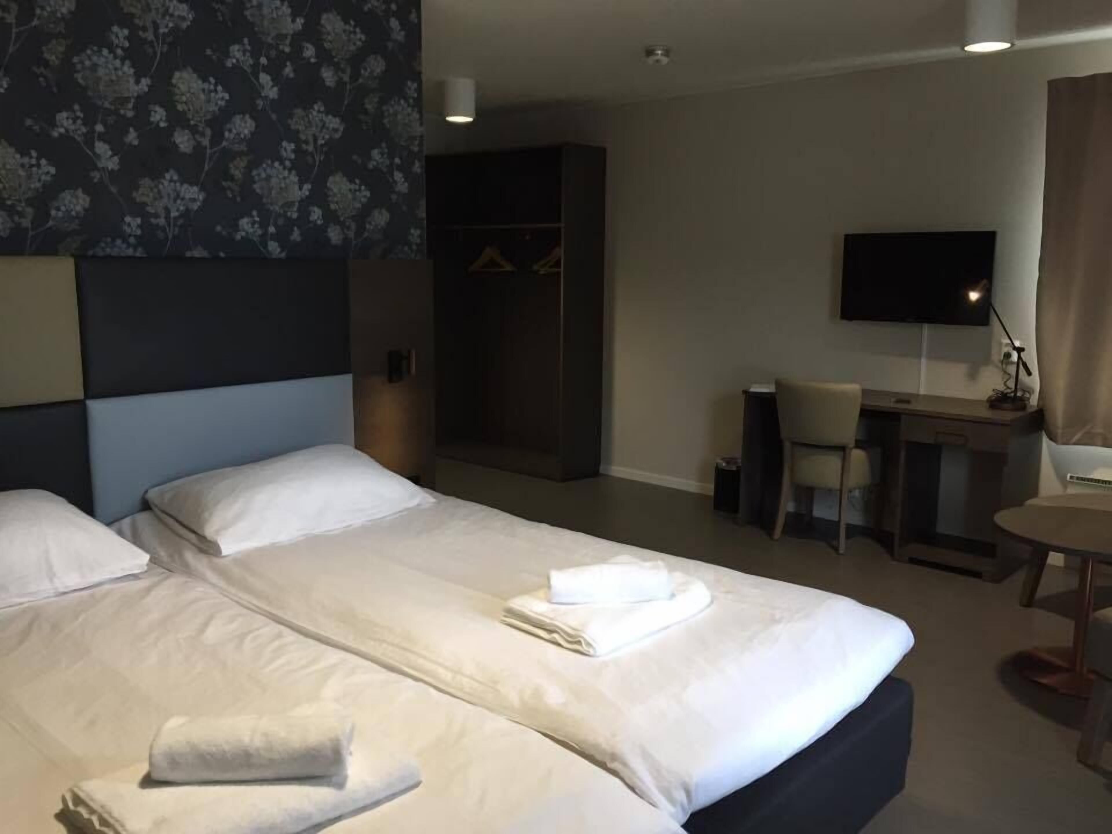 Pillowtop beds, desk, blackout drapes, soundproofing