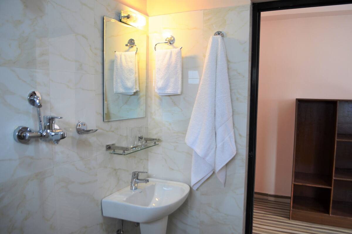 shower, free toiletries, slippers, bidet