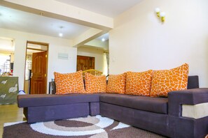 City Apartment, 3 Bedrooms, Non Smoking | Living room | 50-inch flat-screen TV with cable channels, TV, Netflix - Nairobi Airport Apartments (Mlolongo)