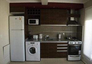 Superior Apartment | Private kitchen - Departamentos Orquera (Sarmiento)