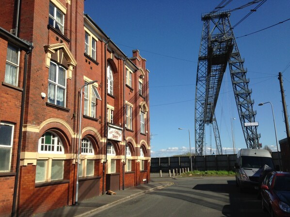 A red brick building with a sign for 'West of England Tavern'. - The West Of England Tavern (Newport)
