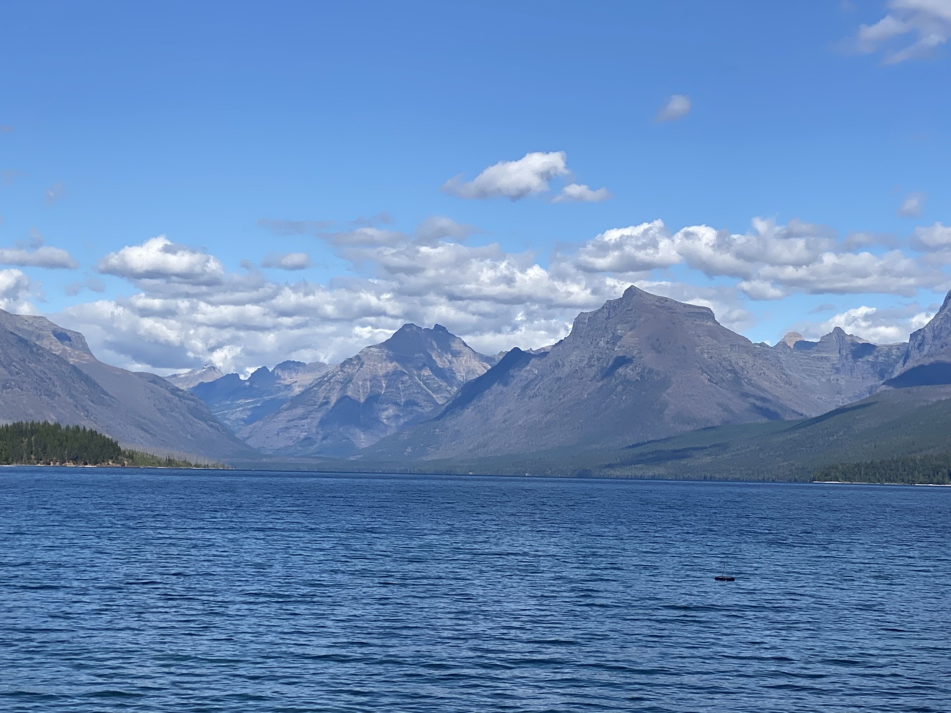 A lake with mountains in the background.