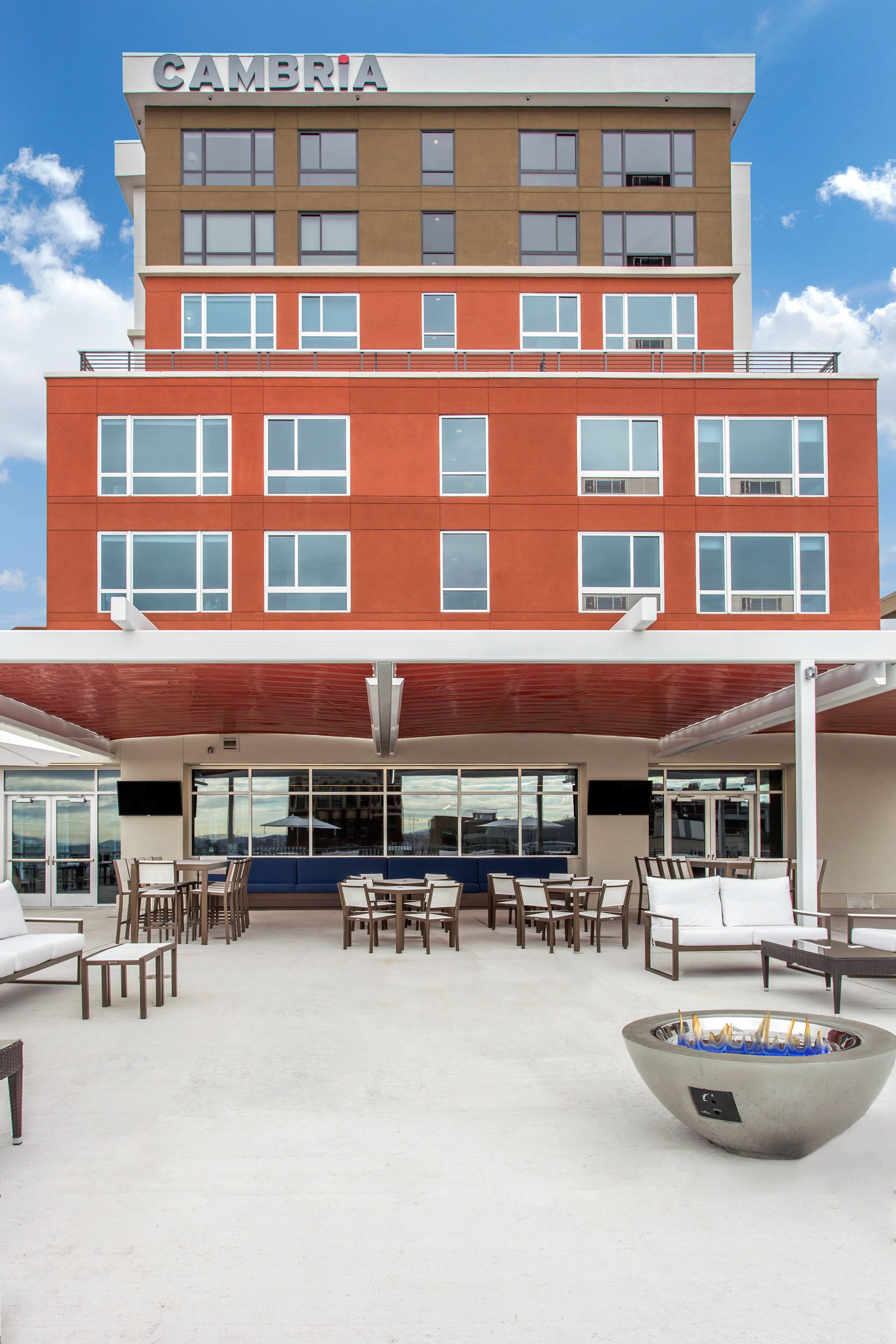 A multi-story building with the name "CAMBRIA" on the top.