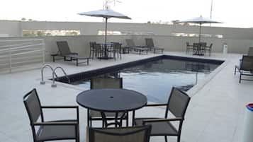 Outdoor pool, open 9:00 AM to 9:00 PM, pool umbrellas, sun loungers