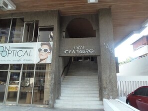 A staircase leading to a building with a sign reading "torre CENTAURO". - Torre Centauro (Cartagena)