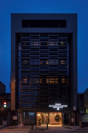 A modern hotel building with a sign reading "GOZAN HOTEL & SERVICED APARTMENT." - GOZAN HOTEL & SERVICED APARTMENT Higashiyama Sanjo (Kyoto)
