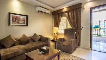 Apartment, 1 Bedroom | Living area | LCD TV