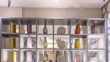 A display of various vases on shelves.
