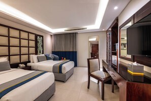 A hotel room with two beds, a desk, a chair, a television, and a minibar. - AL Muhaidb ResidenceAl Olaya 1 - Economic (Riyadh)