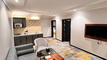 Family Suite, 2 Bedrooms, City View | Living area | LCD TV