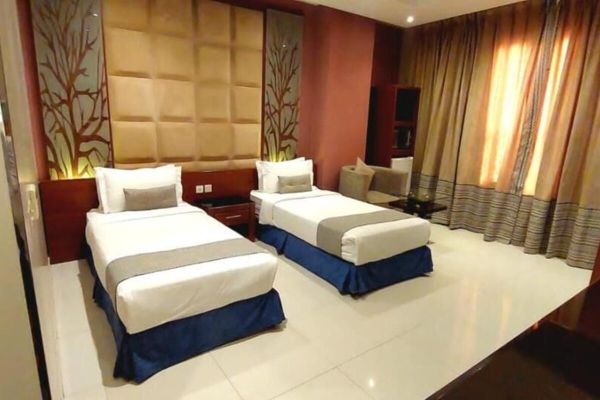 Standard Twin Room | Blackout drapes, iron/ironing board (on request), WiFi (free)