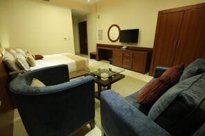 Apartamento, 1 quarto | Área de estar | TV de tela plana