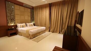 Appartement, 1 chambre | Rideaux d’obscurcissement, fer et planche à repasser