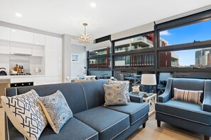 1 Bedroom Deluxe | Living area | 42-inch flat-screen TV with digital channels, TV, DVD player - The Hamptons Apartments - Port Melbourne (Port Melbourne)