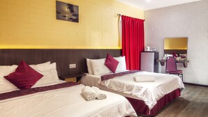 A hotel room with two beds, a desk, a chair, a mirror, and a red curtain. - MyVilla Langkawi Hotel (Langkawi)