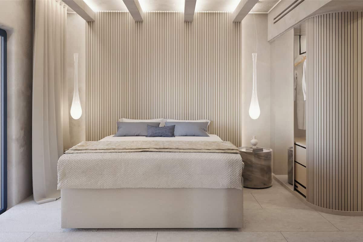 Un dormitorio moderno con una cama grande, una mesita de noche y un armario.