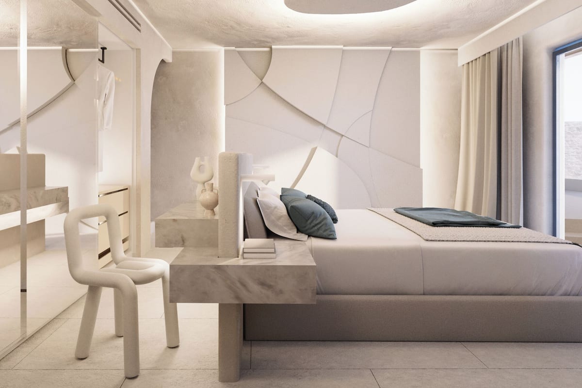 Un dormitorio moderno con cama, mesita de noche, silla y un ventanal grande.