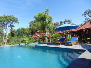 Outdoor pool, pool umbrellas, sun loungers