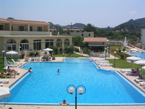 Outdoor pool, open 7:30 AM to 6:00 PM, pool umbrellas, sun loungers