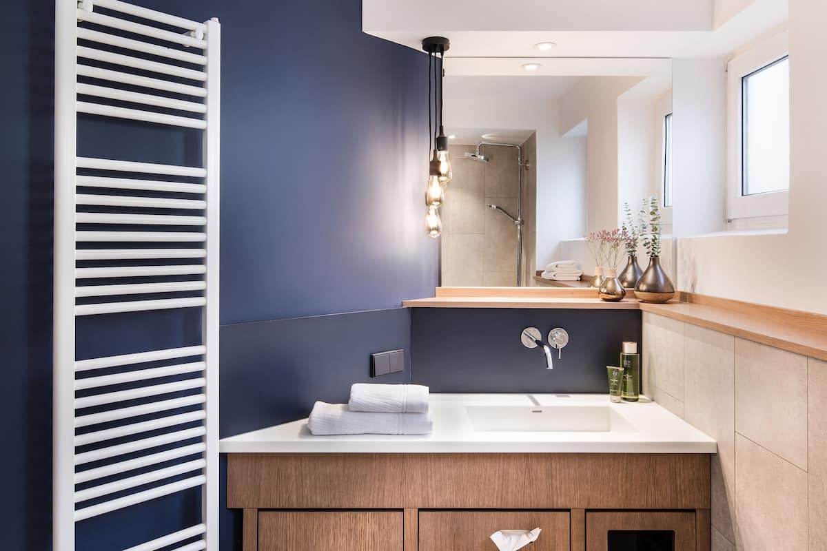 double room, river view | bathroom | eco-friendly toiletries, hair dryer, towels