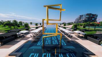 Indoor pool, seasonal outdoor pool, pool umbrellas, sun loungers