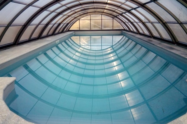 Indoor pool, outdoor pool, pool umbrellas, pool loungers