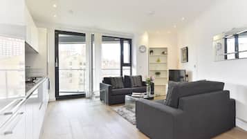 Apartment, 1 Bedroom | Living area | Flat-screen TV, DVD player