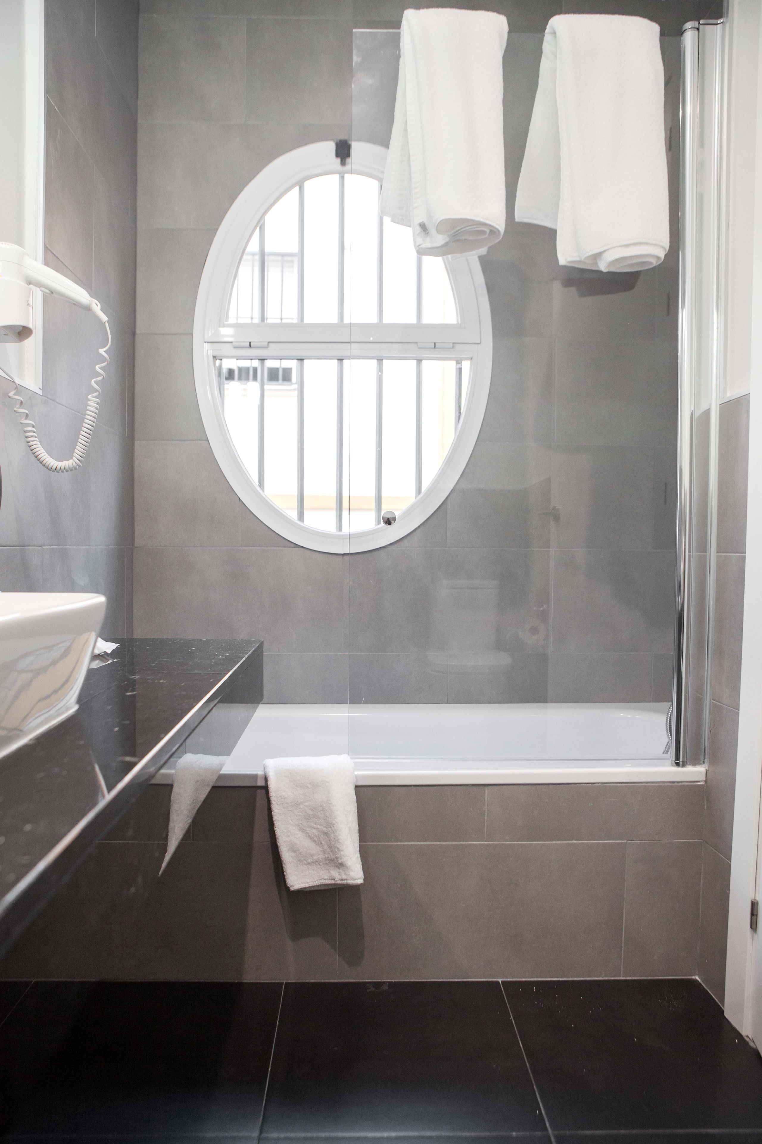 economy double room | bathroom | designer toiletries, hair dryer, towels