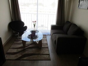 Family Apartment, 3 Bedrooms, Balcony, Pool View | Living room