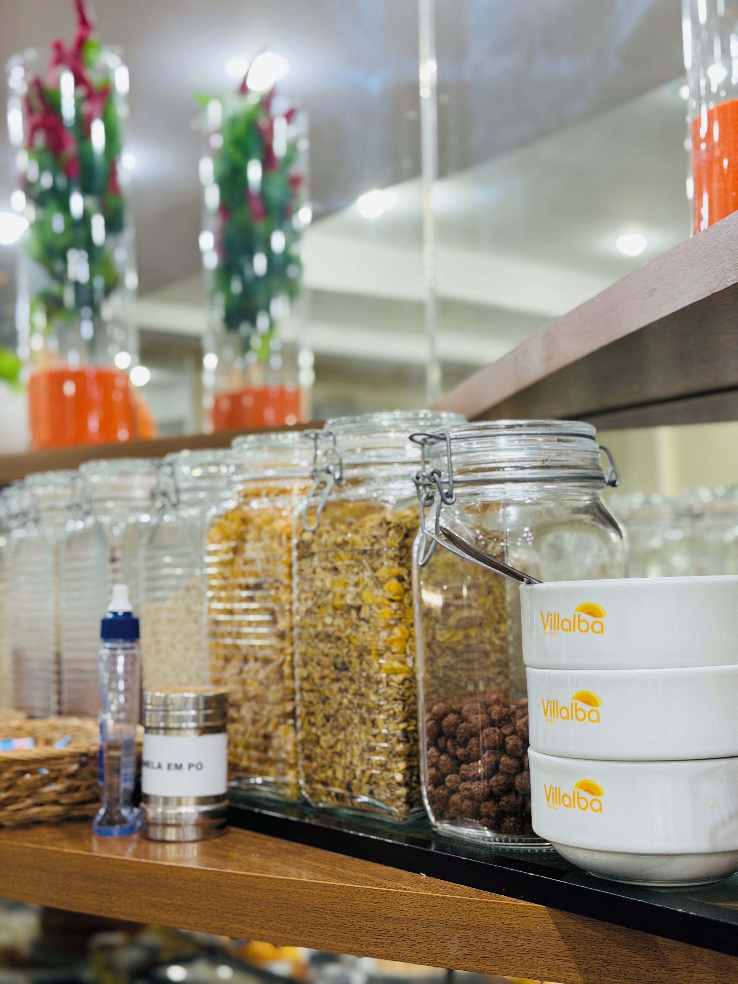 A shelf with various food items and containers, including jars and bowls with the 'VillaBa' logo.