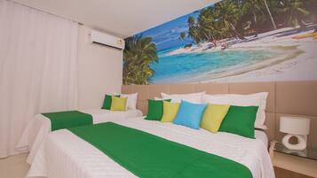 A hotel room with two beds, a beach mural, a white air conditioner, and a bedside table with a lamp.
