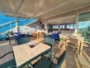 Enjoy al fresco dining with a variety of seating options and expansive views of the surrounding landscape.
