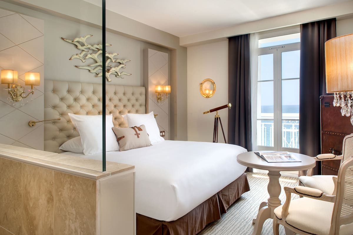 Deluxe Room, Full Sea View | Minibar, in-room safe, blackout drapes, soundproofing