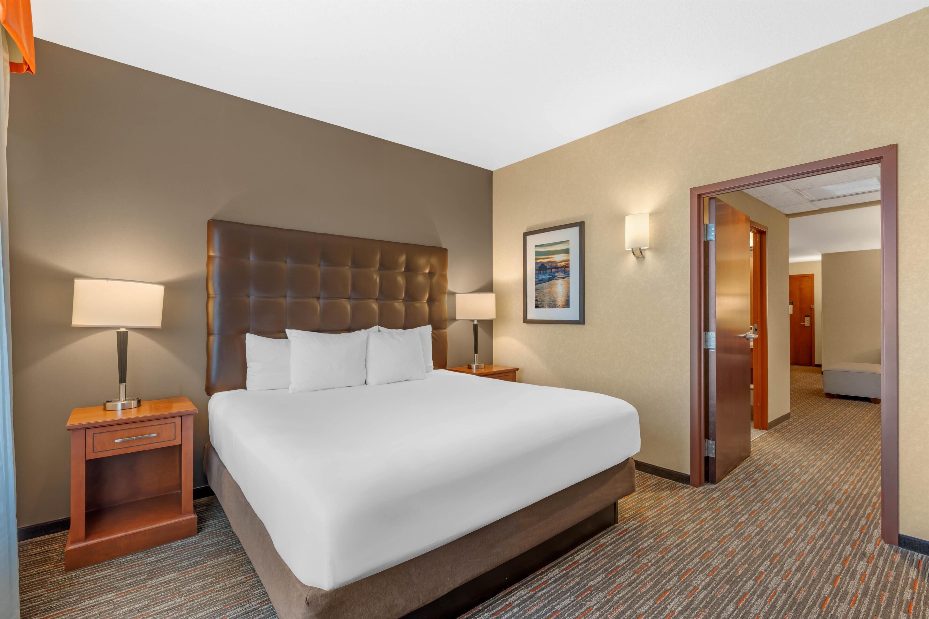 Desk, laptop workspace, blackout drapes, iron/ironing board