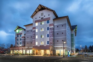 A multi-story Holiday Inn Express hotel with a brick facade and multiple windows. - Holiday Inn Express & Suites Seattle South - Tukwila by IHG (Tukwila)
