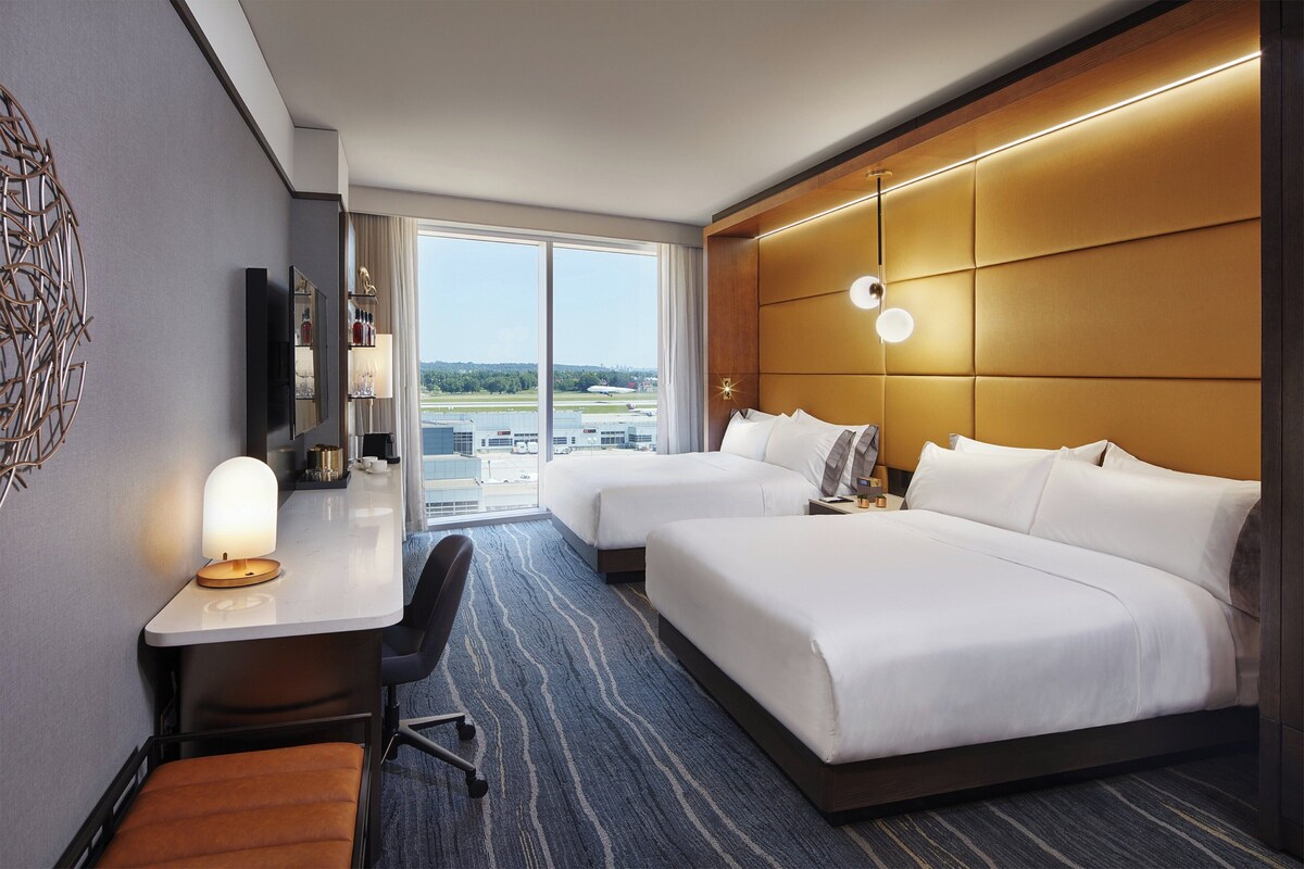 Premium bedding, down duvets, pillow-top beds, in-room safe