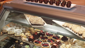 A dessert display case in a restaurant with various pastries and desserts. - del Lago Resort & Casino (Waterloo)
