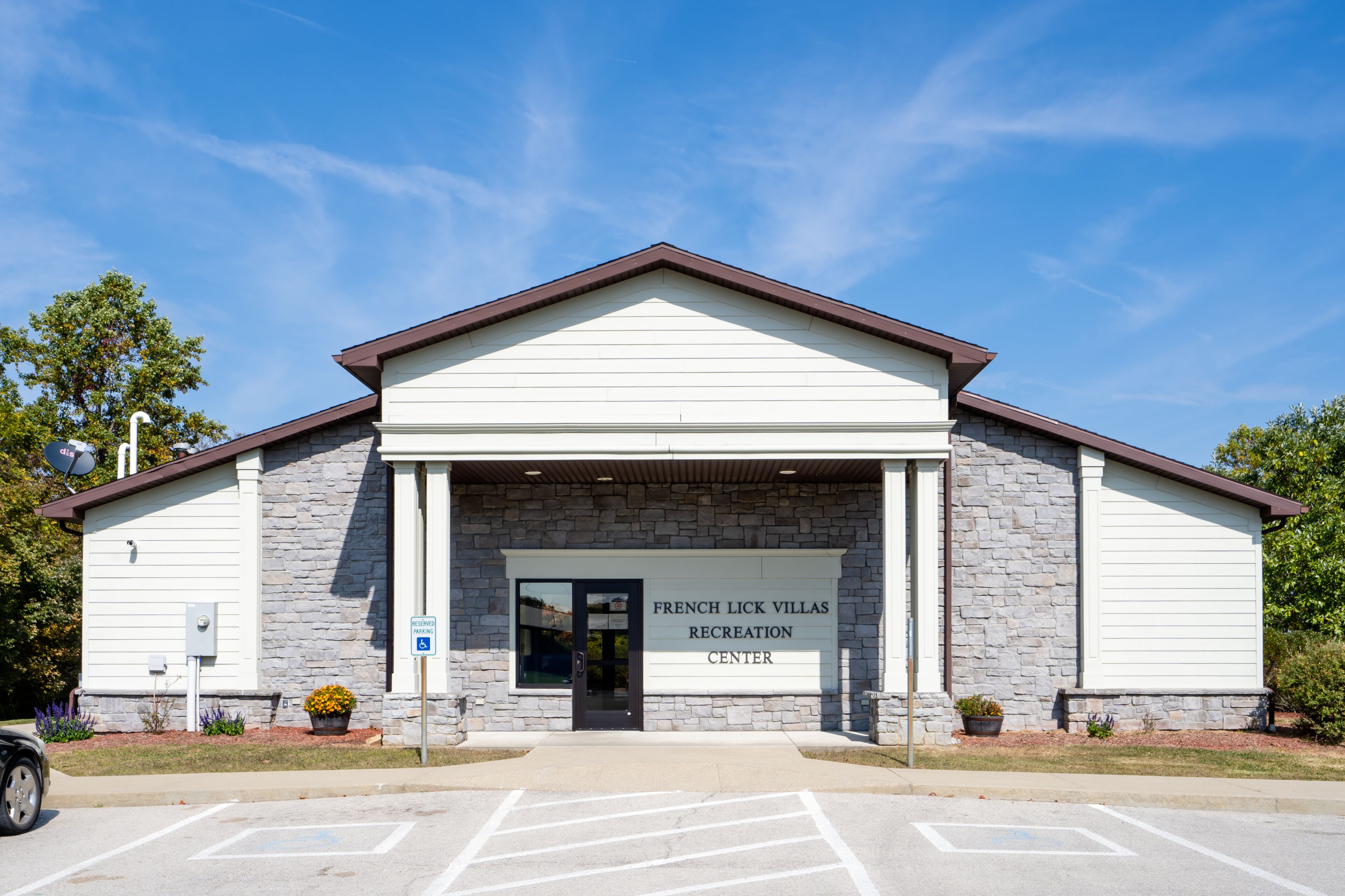 A building with a stone facade and a sign reading "French Lick Villas Recreation Center".