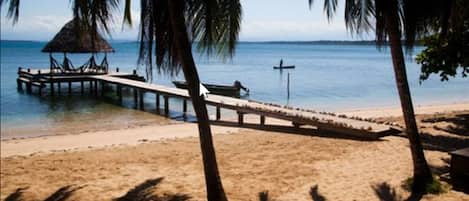 On the beach, white sand, sun loungers, scuba diving