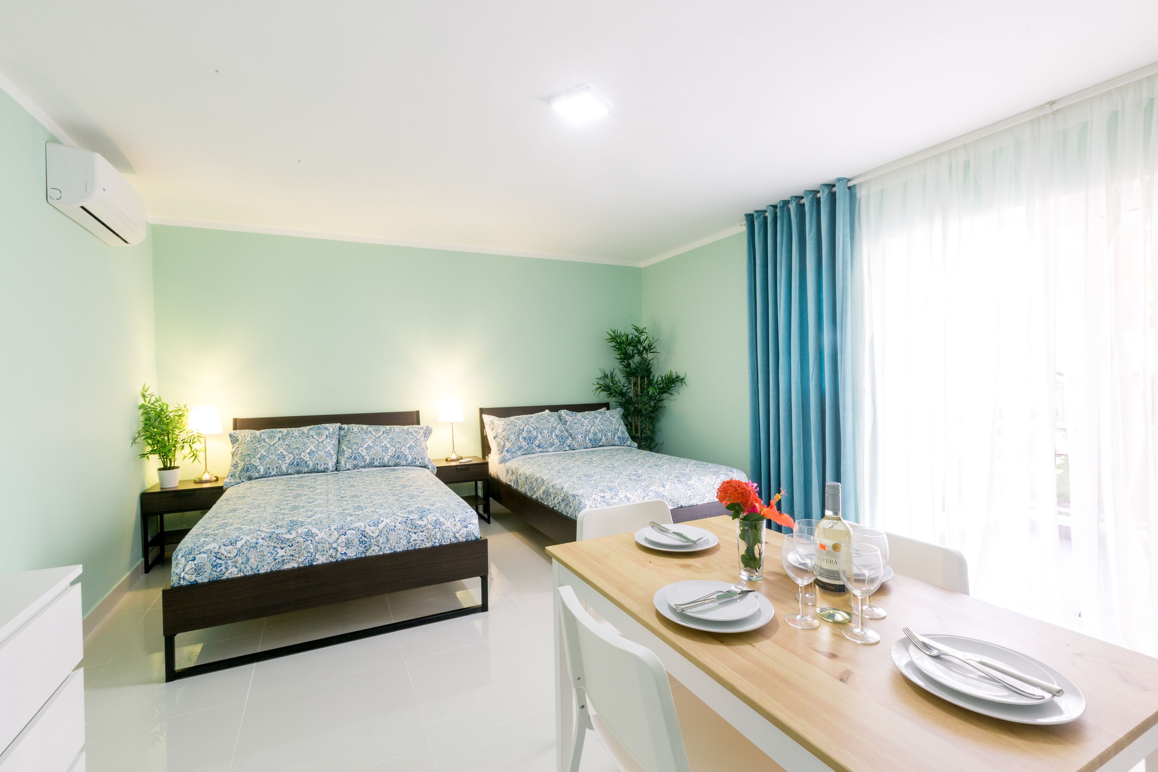 deluxe studio suite, 2 double beds, pool view, poolside | 1 bedroom, in-room safe, desk, laptop workspace