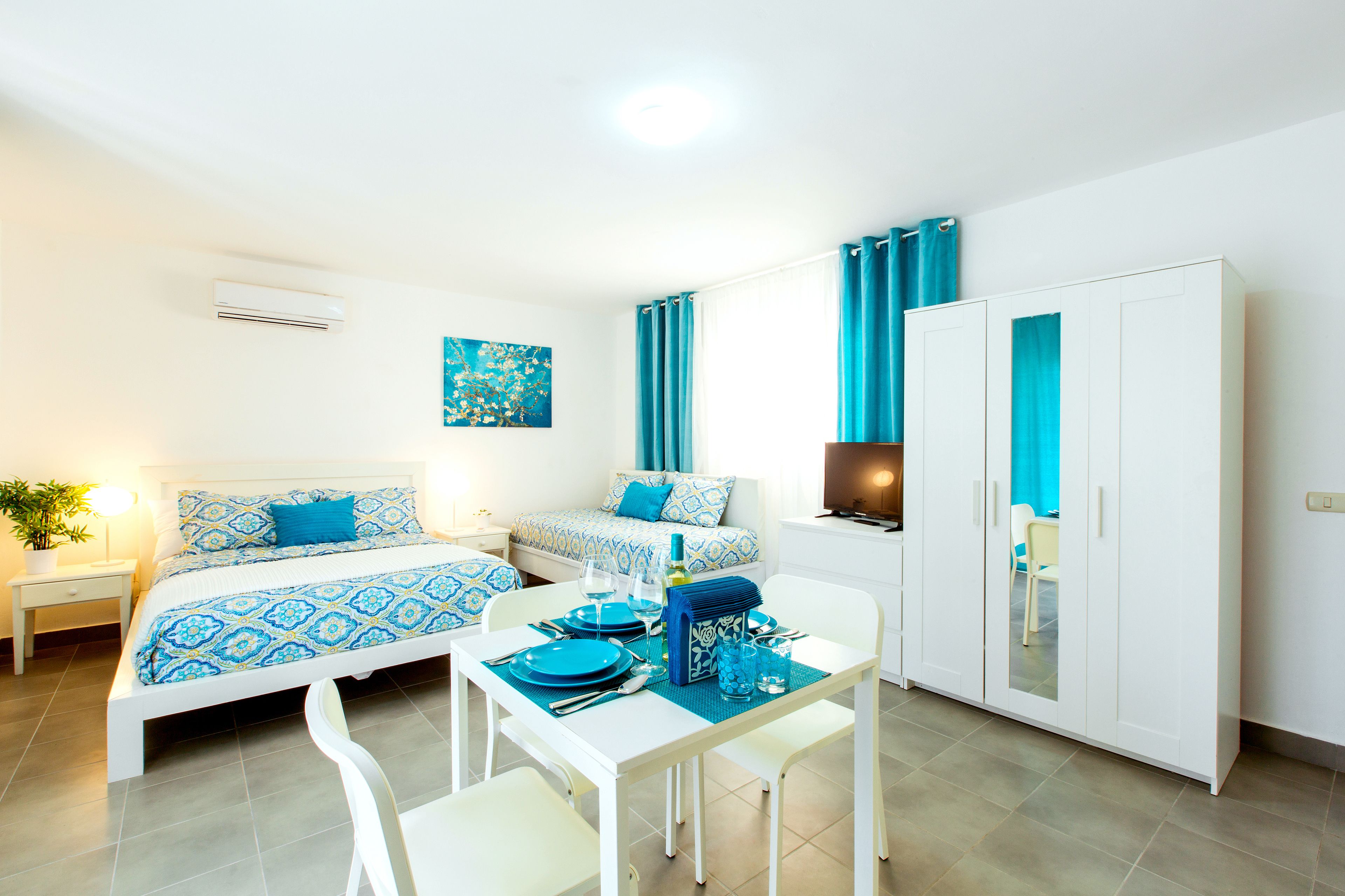 deluxe studio, 1 bedroom, garden view, poolside | 1 bedroom, in-room safe, desk, laptop workspace